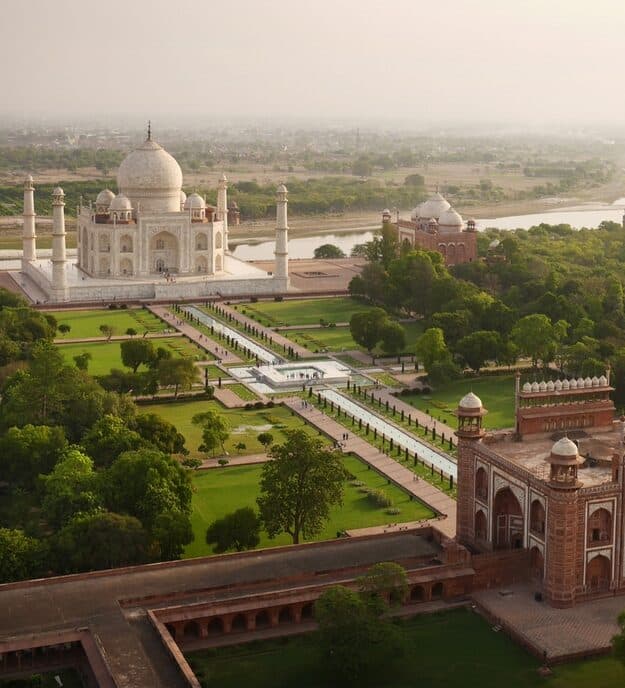 Taj Mahal As The Day's First Tourists Trickle Through The Gates.